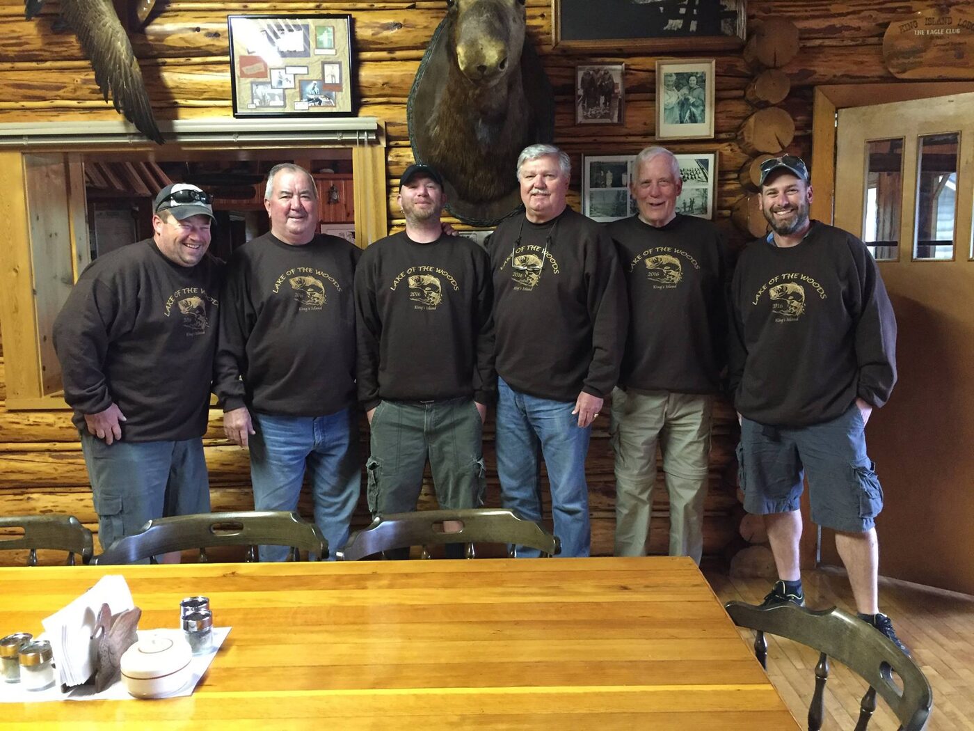 Group of guests gathered in the log lodge
