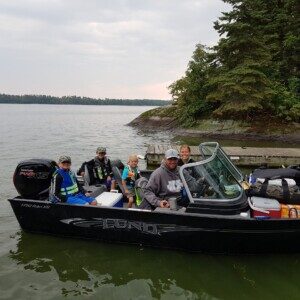 Family loaded into the boat and ready to head out to the island