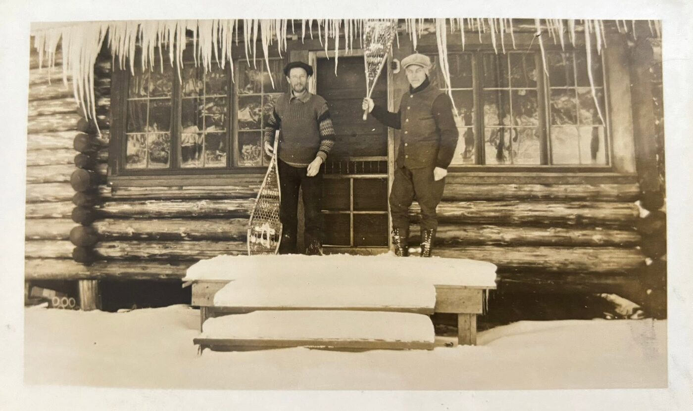 Men on the log cabin steps, vintage