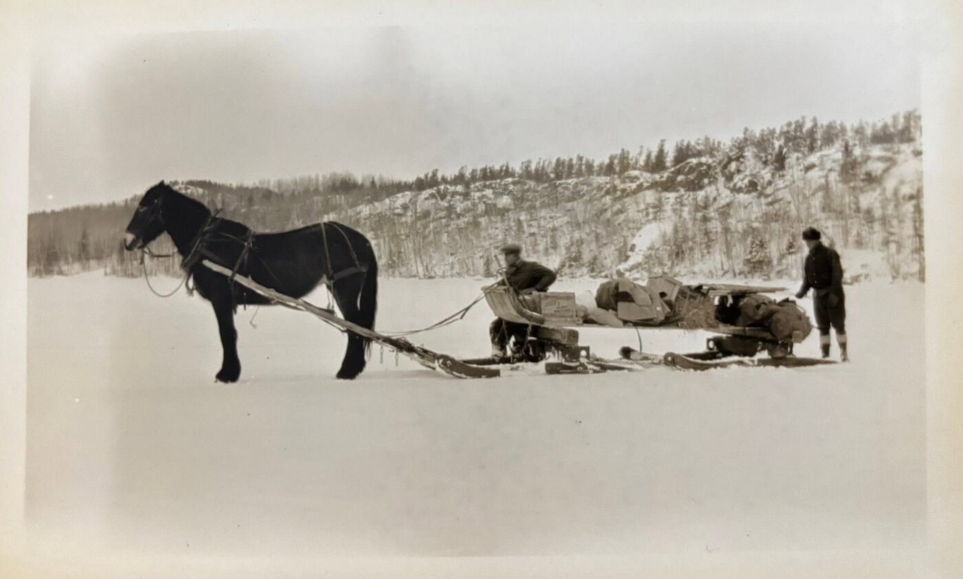 Horse and sled cutting ice in winter