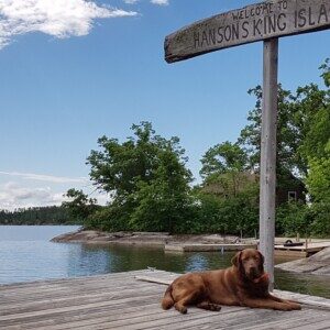 Welcome to King Island sign at the water's edge